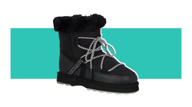 A black boot with shearling cuffs.