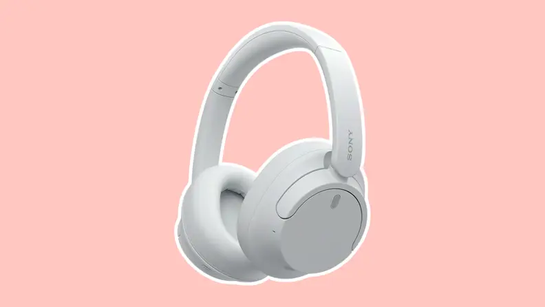 A pair of white headphone from Amazon on a pink background.