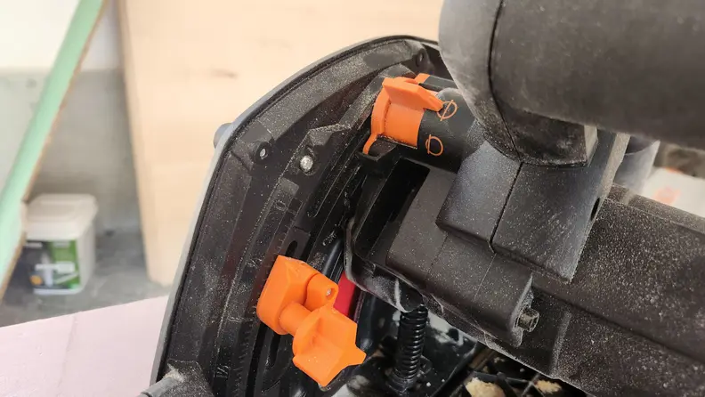 Close up view of the saw dust covered controls on the Wen Track Saw.