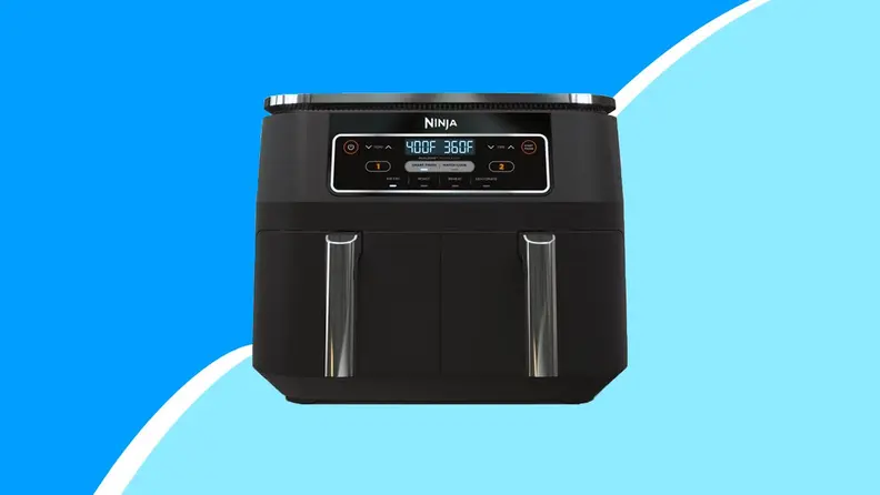 Air fryer on blue background