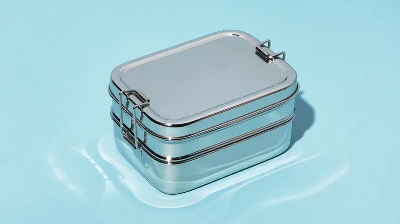 A stainless steel Bento Box with three compartments.