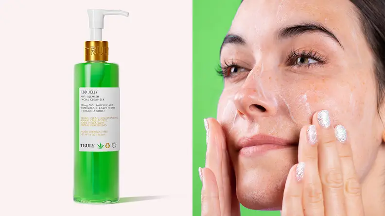 On the left: The green pump bottle of the CBD Jelly Anti-Blemish Facial Cleanser standing against a light pink background. On the right: A woman looks off into the distance and puts her hands to her cheeks to massage in a foamy cleanser.