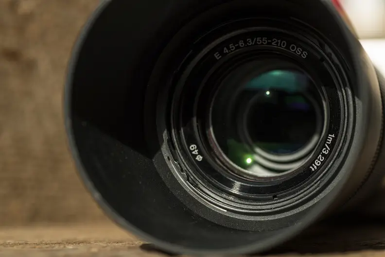 The included lens hood shields the front element from stray light.