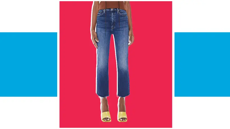 A model wears a pair of dark blue jeans and yellow heels.