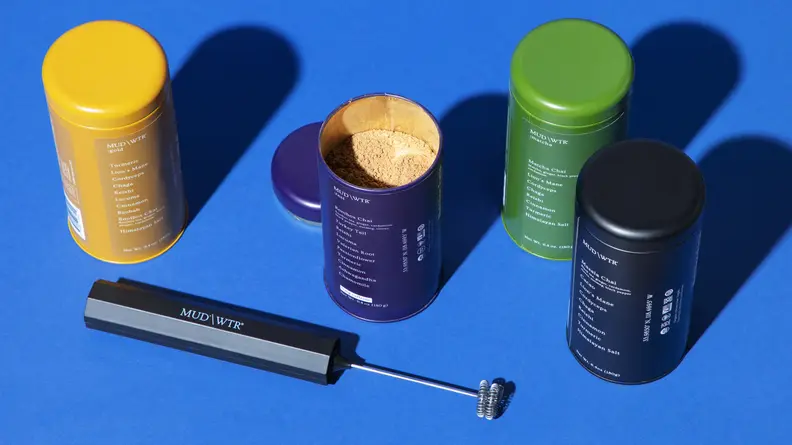 Four containers of Mud/Wtr, one open, and a hand-held blender is next to the containers.