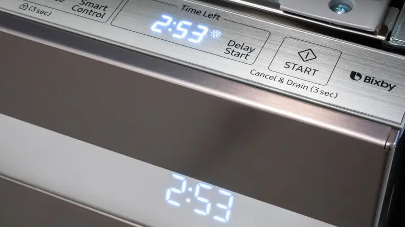 The Samsung DW80R9950UT/AA dishwasher has a top-facing control panel with a clean, intuitive layout.