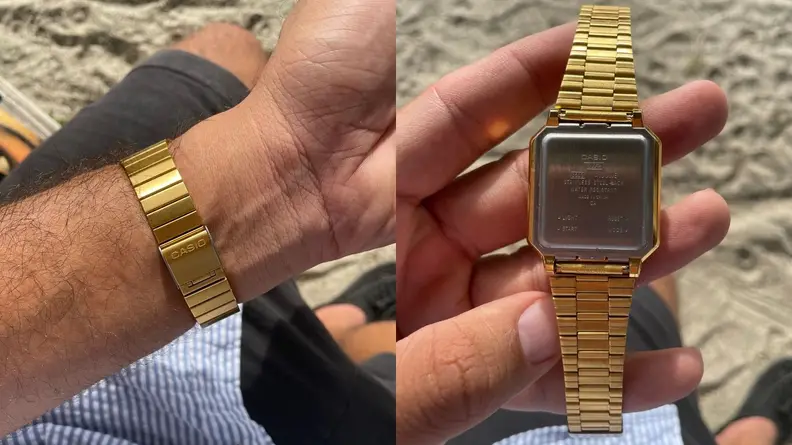 Man showing band on Casio-A100WEG-9AVT, man holding Casio-A100WEG-9AVT and showing off face.