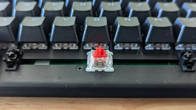 Close up of a keyboard switch with a red tip