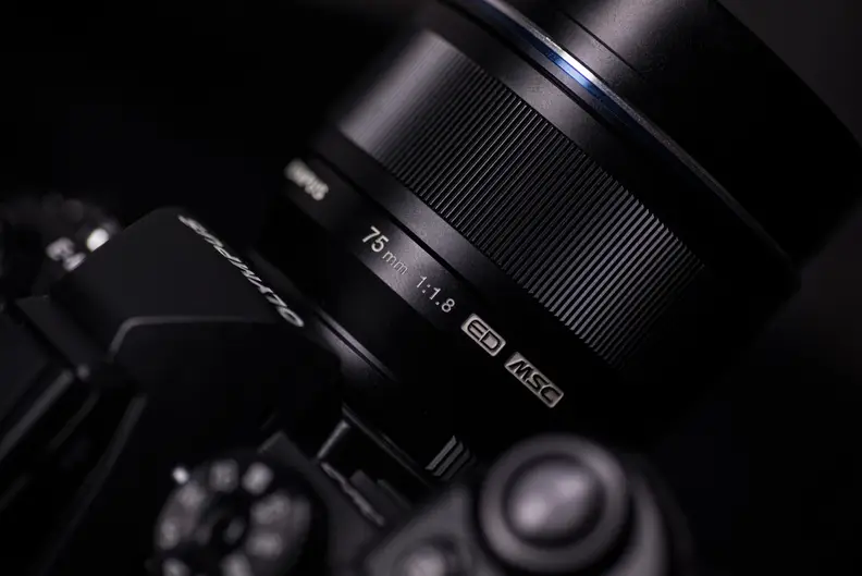 We prefer the black version of the 75mm f/1.8. Annoyingly, the silver finish doesn't match Olympus's own cameras.