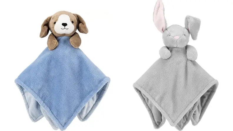 Two blankets with animal plushies attached to a corner