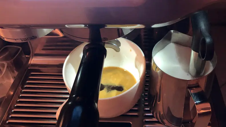 Espresso dripping from the Oracle Touch portafilter