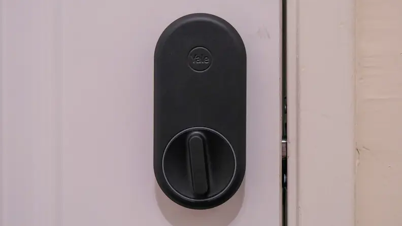 The Yale Approach smart lock mounted to a white door
