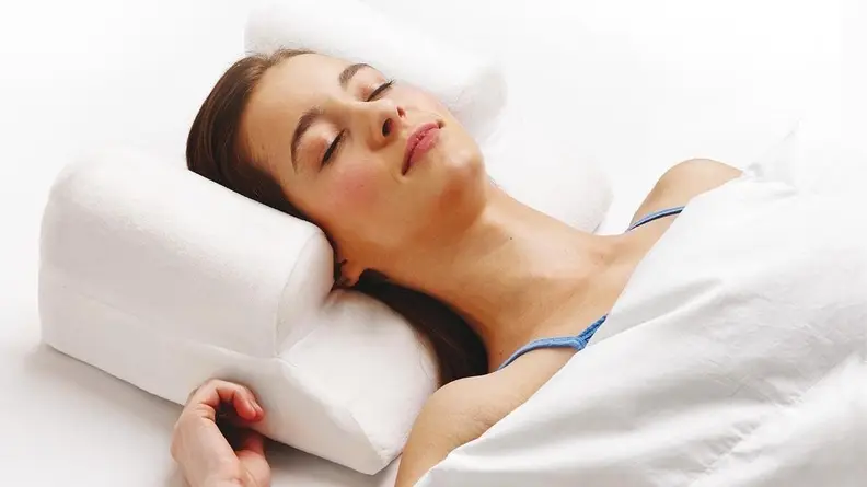 This pillow will keep your head in place as you sleep.