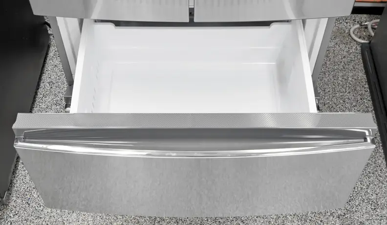A close-up of the Haier HRF15N3AGS's upper freezer drawer .