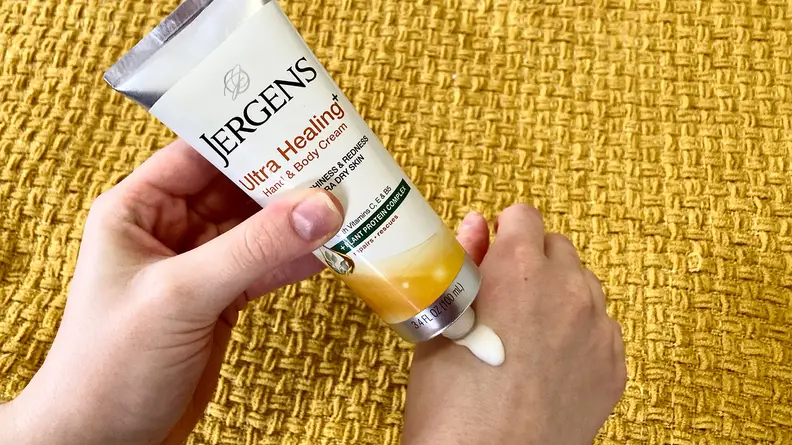 The author applying the Jergens Ultra Healing Hand & Body Cream to her right hand.