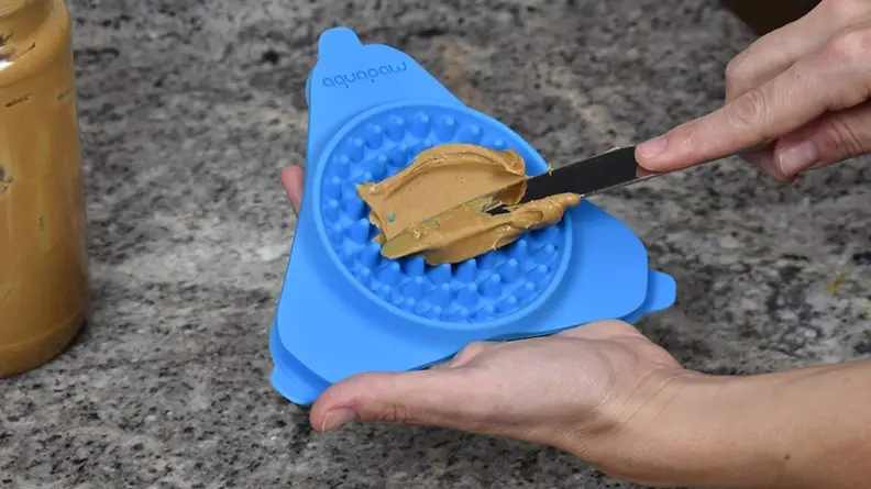 This silicone mat sticks to the wall of your shower.