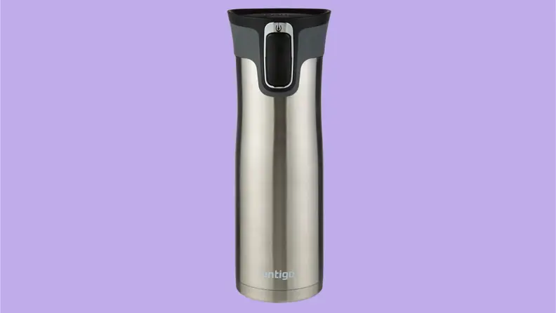 A silver travel mug on a purple background