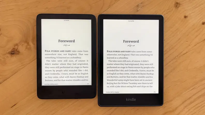 Two Amazon Kindles sit side-by-side to illustrate how much text each of their displays can hold.