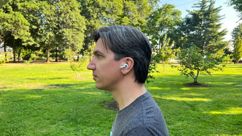 A profile shot of tester Ryan Waniata wearing the Apple AirPods Pro (second gen) in public.