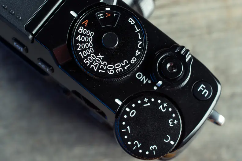 Pretty much all cameras have some kind of exposure compensation tool, either a button you press or a dial like on this camera.