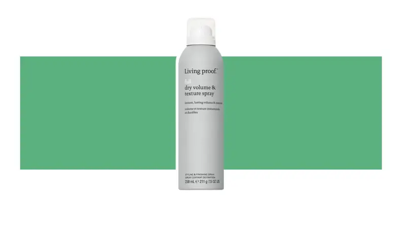 Living Proof. hair product on a green background.