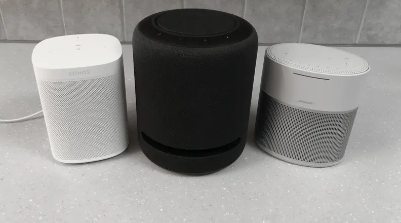 Sonos One, Echo Studio, and Bose Home Speaker 300 on counter