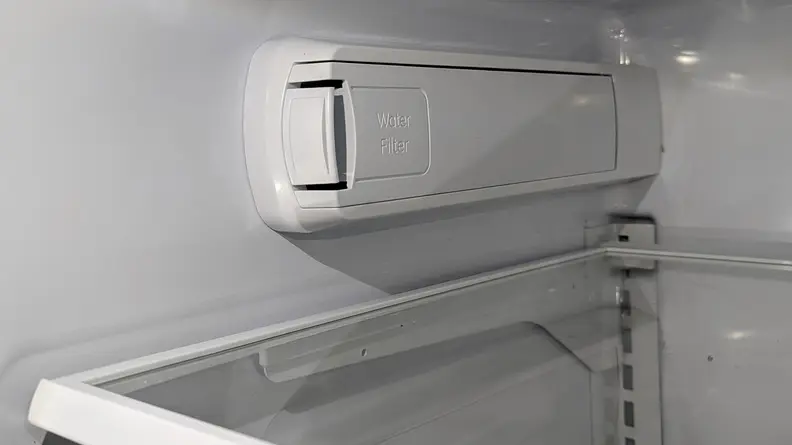 A cl0se-up of the fridge's water filter, located on its left wall.