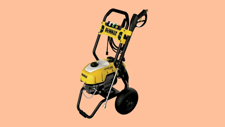 A DeWalt DWPW2400 pressure washer sits on a peach colored background.