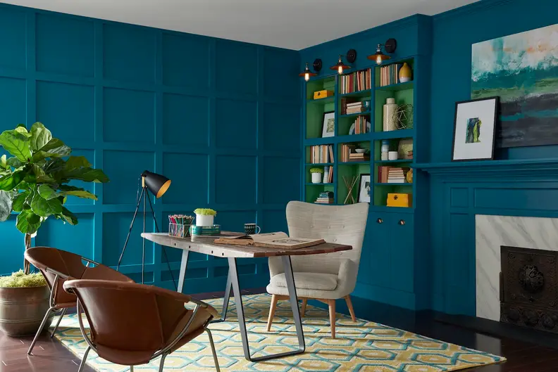A deep teal envelops this room