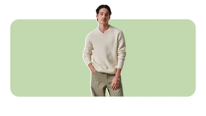 A brushed off-white v-neck sweater.