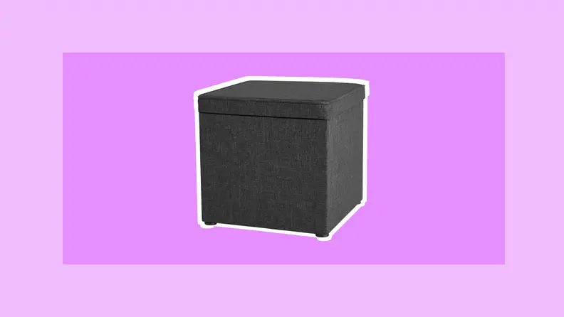 Cube-shaped gray cloth covered ottoman to place in your dorm room for extra storage.