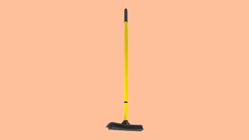 Furemover rake against a peach background