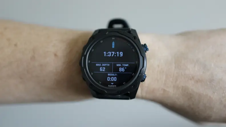 Person wearing the Garmin Descent MK2i smart watch on wrist.