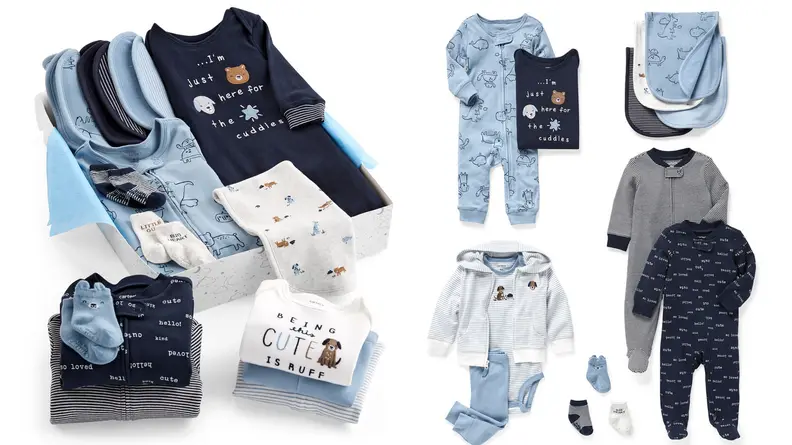 A collection of blue and white baby clothes