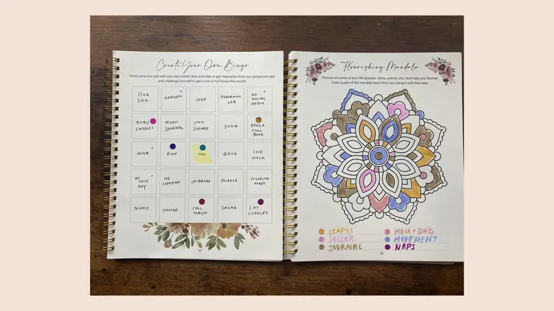 open journal on pink background