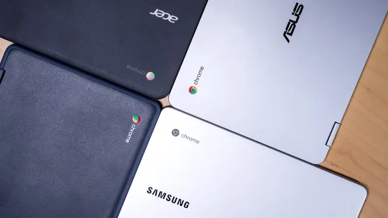 4 laptops making a clover pattern on a desk