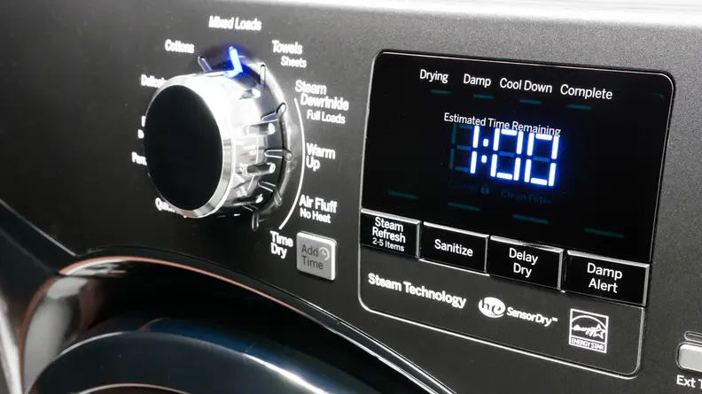 A close-up of the GE GFD45ESPM1DG dryer's control panel, which consists of a cycle-selection dial next to an LED display panel that's surrounded with cycle option buttons.