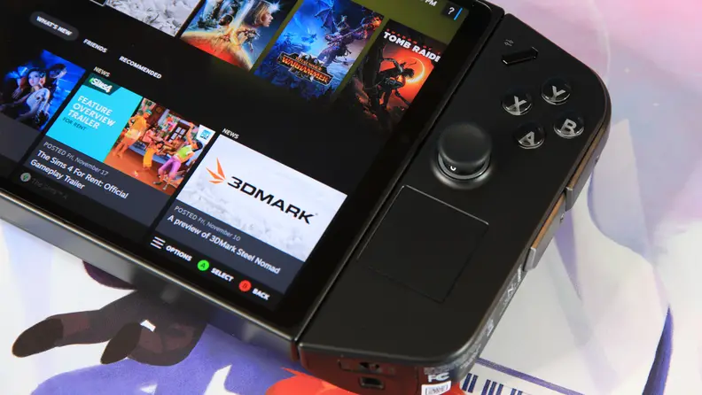 A black gaming handheld with  detachable controller