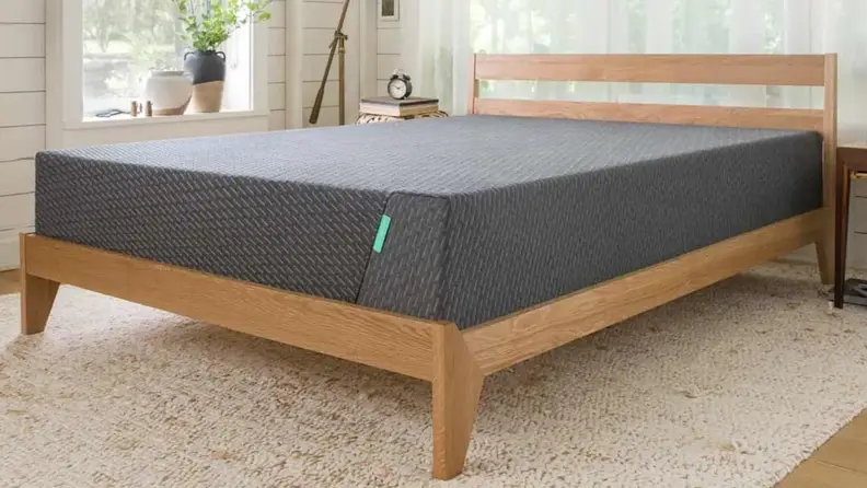 Close up of a Tuft & Needle mattress in a bedroom
