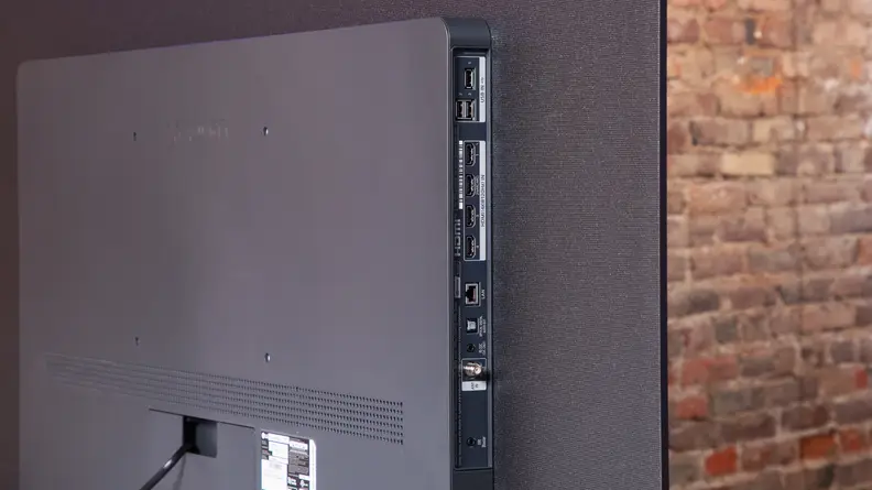 Angled shot of the back of the LG C3 OLED TV with HDMI ports.
