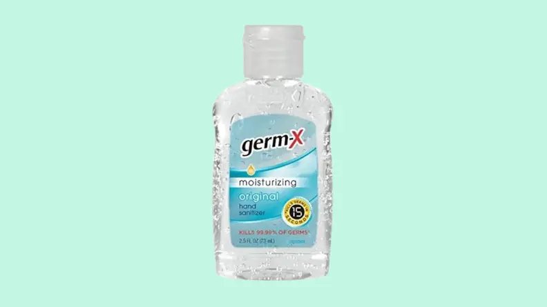 Bottle of hand sanitizer against blue background