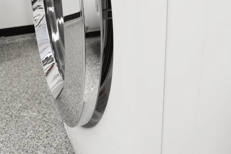 The door automatically keeps ajar to dry out the drum.