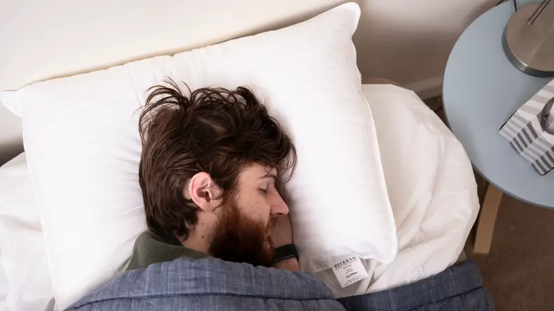 a man sleeps on the beckham hotel pillow