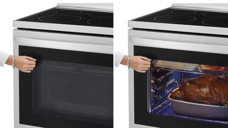 Person using hand to knock on glass of LG LREL6325F oven.