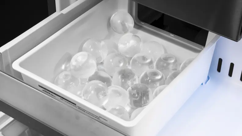 If you're looking for the spherical Craft Ice, it has a dedicated bin down in the freezer drawer.