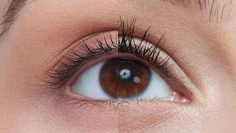 Half of a woman's eye wearing the Maybelline Lash Sensational Sky High Mascara and the other half with bare lashes.