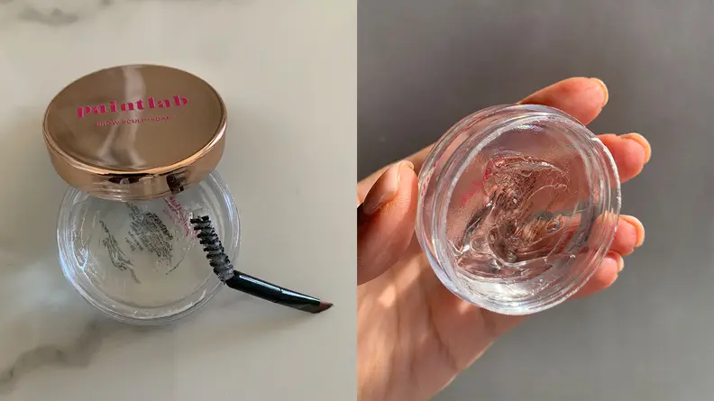 On the left: A clear jar with clear brow gel in it uncapped with its gold lid and spoolie brush leaning on the jar. On the right: A closeup on the clear jar with clear brow gel in it in someone's hand.