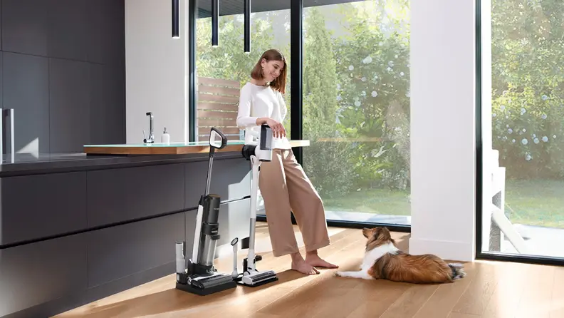 Woman next to the Tineco Floor One Switch S7