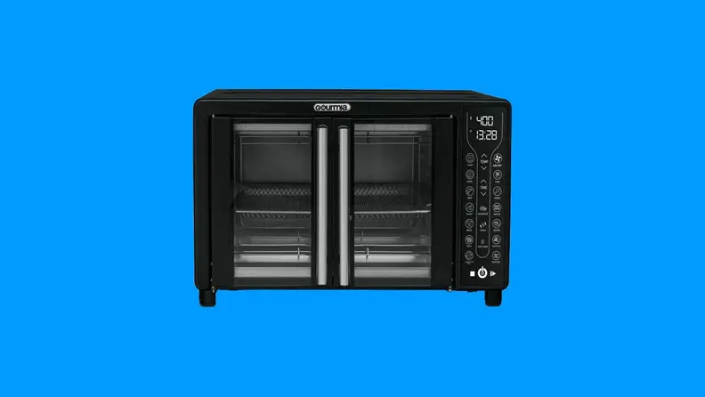 A Gourmia toaster oven against a blue background.