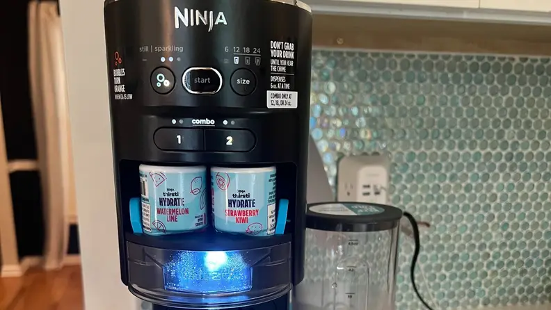 Close-up of two flavor drops installed in the Ninja Thirsti.
